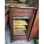 A 19" Edwardian walnut music cabinet with velvet lined shelves enclosed by a bevelled glazed panel