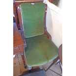 A late Victorian moulded walnut part show frame nursing chair with green velour upholstery to back