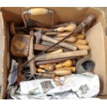 A box of woodworking and other tools including screwdrivers, mallet, etc.