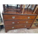 A 3' 6" 19th Century mahogany chest of three long graduated drawers with embossed thistle back plate