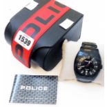 A Police black PVD coated sports wristwatch with quartz movement, presentation box and booklet