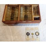 A cigar case containing W. Watson glass microscope slides including polycystine from Springfield,