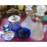 Two moulded glass decanters with plated collars, a biscuit barrel, two glass dishes, and a pottery