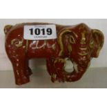 An antique Chinese pottery elephant with flambe glaze