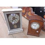 A later painted cased American shelf alarm clock with visible pendulum - sold with an Art Deco oak