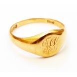 A hallmarked 18ct. gold gentleman's signet ring with engraved initials