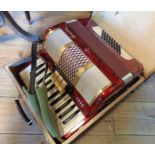 A small cased Galotta 48 button piano accordion
