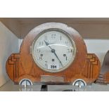 A 1930`s inlaid walnut Art Deco mantel clock with eight day chiming movement - bearing