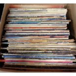 A large mixture of assorted vinyl LPs including ELP, Bob Dylan, Johnny Cash, Don McLean, Leonard