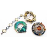 Three Scottish white metal brooches, set with various hardstones and a pale citrine set bracelet -