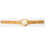 A vintage Lings 21 Prix gold plated day/date wristwatch with Swiss movement, on a marked CT 18/750