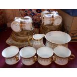 A Cauldon bone china part tea set comprising twelve trios, two bread and butter plates, milk jug and