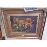 O. Clare: an ornate gilt framed oil on board still life with various fruits and foliage - bears an