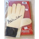 A Puma goalkeeper glove signed by Bob Wilson