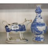 An 18th Century delftware vase - sold with an early 19th Century pearl ware blue and white Willow