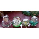 Four decorative glass paperweights