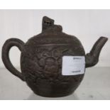 A Chinese Yixing terracotta teapot with lion on lid