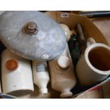 A box containing assorted stoneware hot water bottles, J. Ferguson of Plymouth ginger beer bottle,