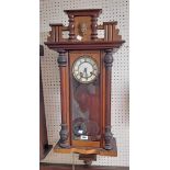 A late 19th Century walnut and mixed wood cased Vienna regulator style wall clock with enamelled