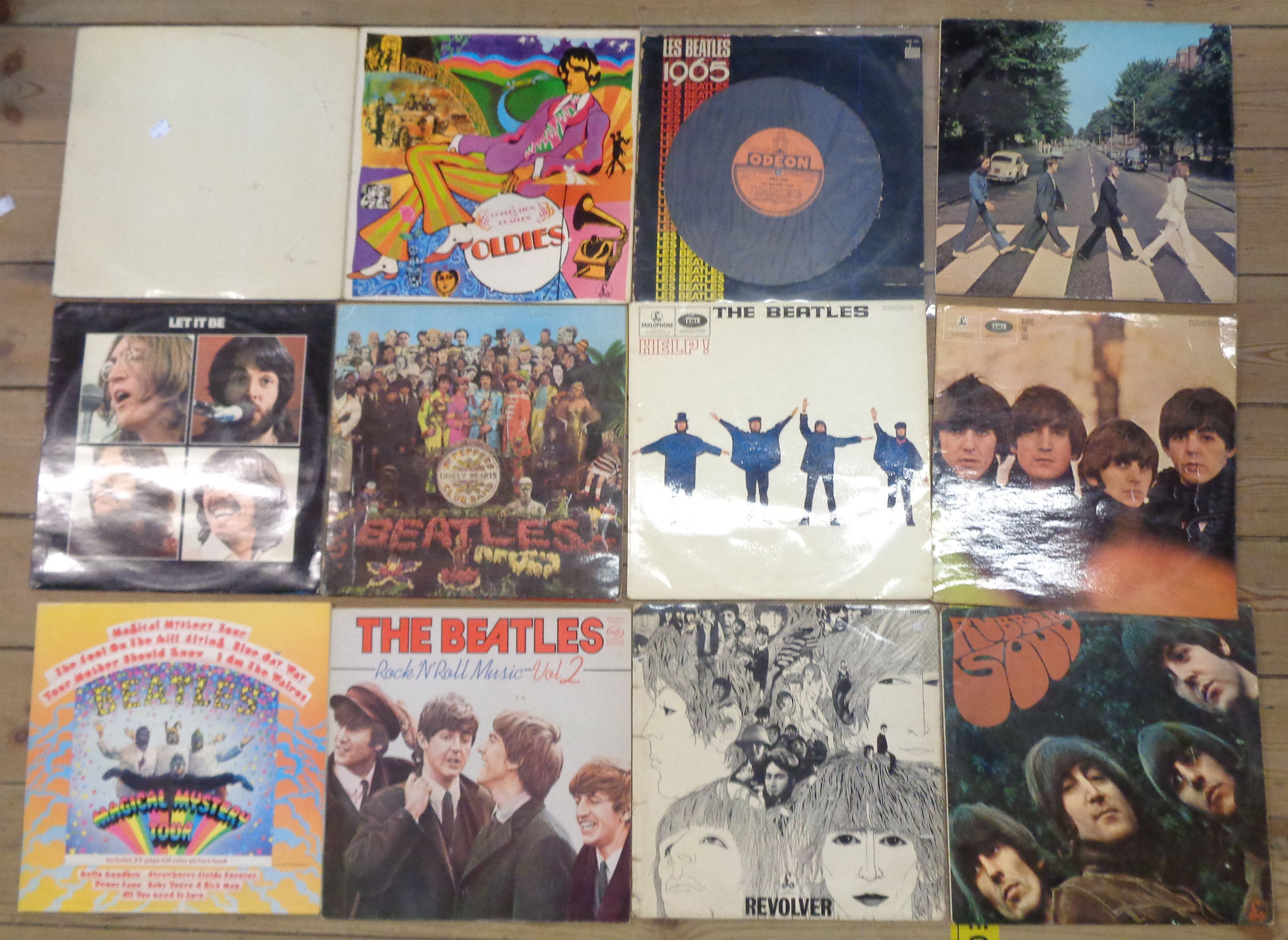 Twelve The Beatles vinyl LPs including White Album, Magical Mystery Tour, and Sgt Pepper, etc. -