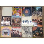 Twelve The Beatles vinyl LPs including White Album, Magical Mystery Tour, and Sgt Pepper, etc. -