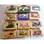 A box containing assorted die cast advertising lorries and vans