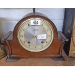 A vintage Garrard polished oak cased mantel clock with scroll sides and eight day gong striking