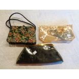 A vintage Waldy purse - sold with a 1950`s Florida celluloid clutch purse and another similar with