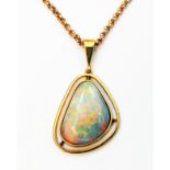 An 18ct. bespoke pendant for a loose bought opal, on marked 375 neck chain - copy of stone receipt