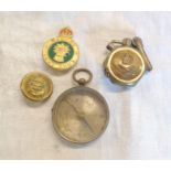A Women's Land Army badge, a RAF trench art lighter, a Victorian pocket compass and a Royal Navy