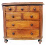 A 16" 19th Century mahogany miniature bow front chest with three short drawers, two further short