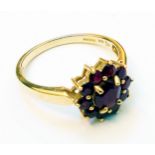 A hallmarked 585 gold ruby cluster ring