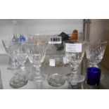 Various glass bowls, cased glass scent bottle (lid broken), paperweights, glasses, etc.