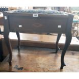 An Edwardian walnut and strung locker piano stool with remains of tapestry to seat, set on