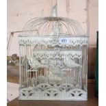 A graduated set of three wire bird cages