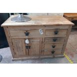 A 3' 11" old stripped pine dresser base with four short drawers to one side and longer drawer with