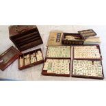 An early 20th Century Chinese cased Mah-Jong set with bone and bamboo tiles, bone counters and