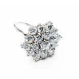 A marked 18ct white metal large diamond cluster ring with stepped claw settings
