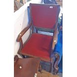 A 20th Century mahogany framed sabre leg elbow chair with studded upholstery