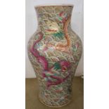 A large Chinese baluster vase depicting five air dragons fighting over a flaming pearl on a crashing