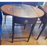 A 29" overall antique mahogany drop-leaf side table with deep frieze drawer, set on square tapered