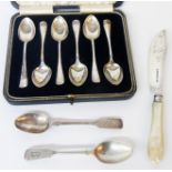 A cased set of six silver teaspoons - sold with a silver bladed fish knife and two other silver
