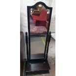 A modern mahogany effect cheval mirror with flanking turned supports and locker box under - some