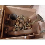A box of assorted metalware including shell cases, brass doorknobs, etc.