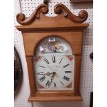 A modern waxed pine framed battery wall clock with longcase style arched dial marked for Duncan