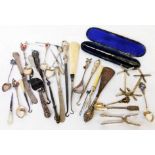 A collection of silver handled and white metal small cutlery items and button hooks, also pair of