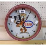 A reproduction painted tin cased Esso advertising clock with battery movement