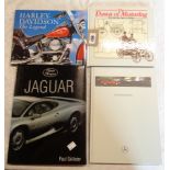 A small collection of automobila related books and ephemera including Harley Davidson, Jaguar, etc.