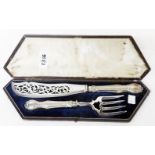 A cased pair of Victorian ornate silver plated fish servers with pierced and embossed decoration,