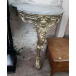 A 25 1/2" ornate shaped marble topped console table, with Rococo style later painted giltwood